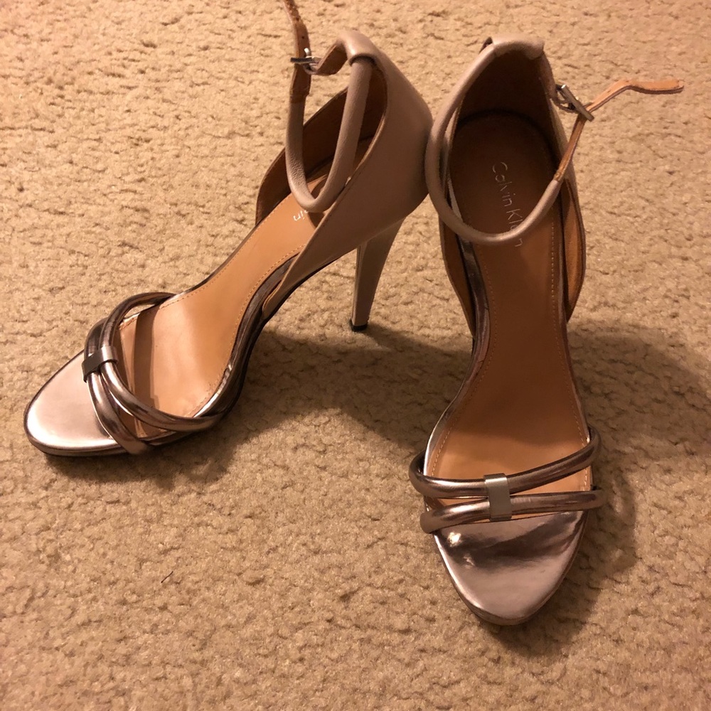Silver and Nude Calvin Klein shoes.